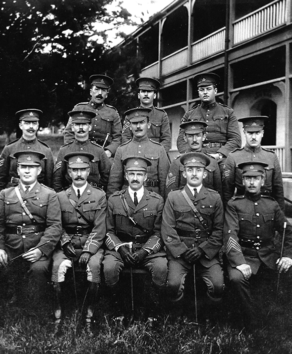 A black-and-white photo of Officers and NCOs of the 38th Ottawa Battalion stationed in Bermuda 2015-2016, Charles Hamnett Pinhey at far right middle row (PPF Collections, Gift of Constance Snelgrove)