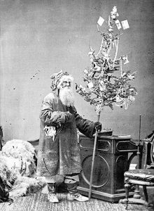Front cover of a PPF Christmas card featuring a photo of Dr. Hamnett Hill as Santa Claus 1876, W.J. Topley, LAC PA-189666