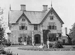 A circa 1872 black-and-white stereoview image of Earnscliffe, erected in 1857, the first of Ottawa's pinwheel floorplan villas. It was later the home of Prime Minister John A. Macdonald.