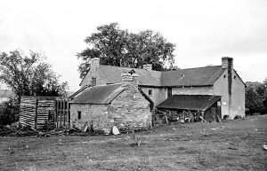 Black-and-white photo showing a Rear view of Horaceville, Pinhey's Point, with collapsed original wing, ca. 1971, National Capital Commission, PPF Collection
