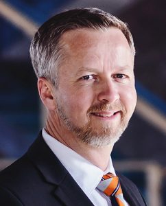 A colour photo of guest speaker Malcolm Wildeboer, an architect with Vandenberg & Wildeboer Associates, South March